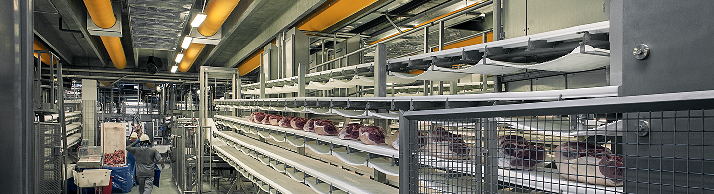 Orange industrial duct systems inside Danish Crown meat processing facilities, DK, 2