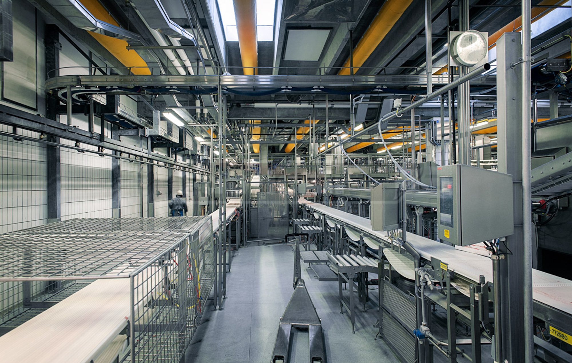 Orange ducts for air conditioning inside DC Danish Crown meat processing facilities, DK, 2