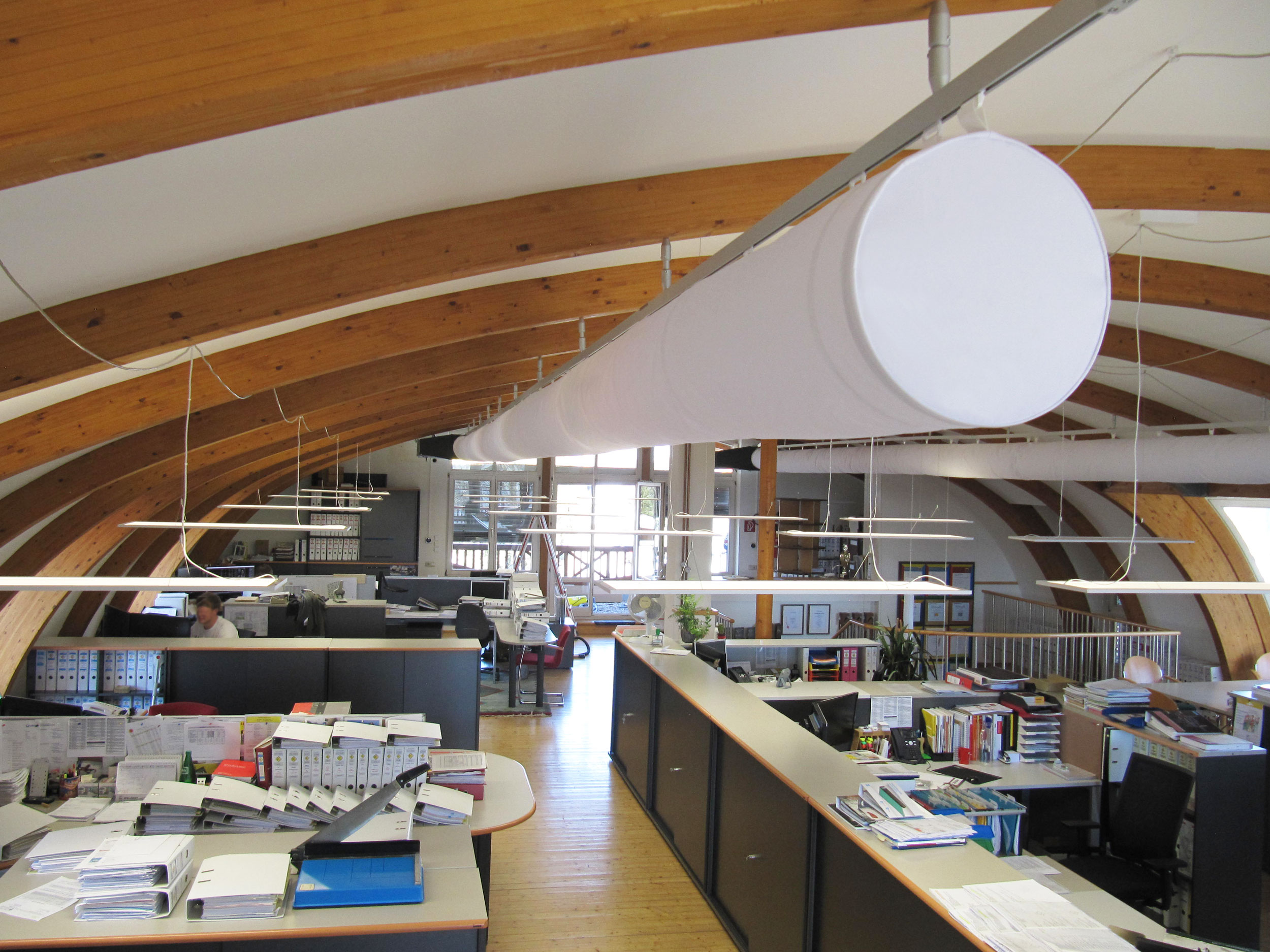 White oval ductwork installed in an office, 2