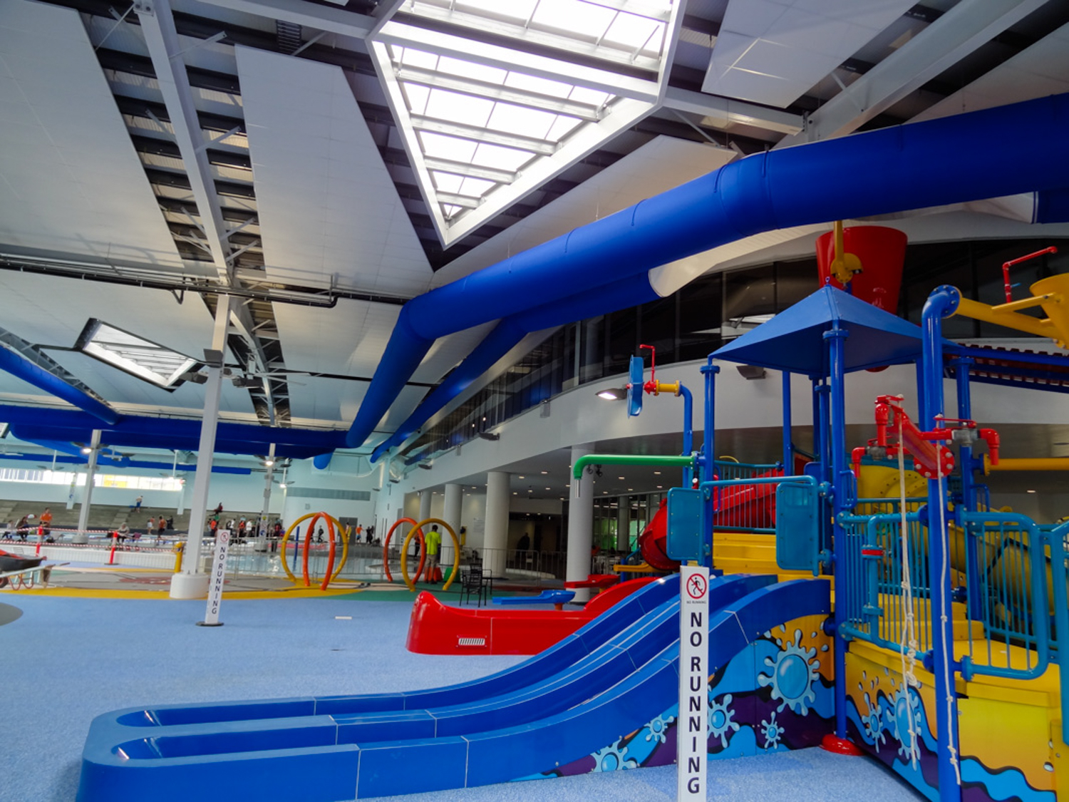 Blue air ducts installed in Greensborough indoor swimming pool, Australia