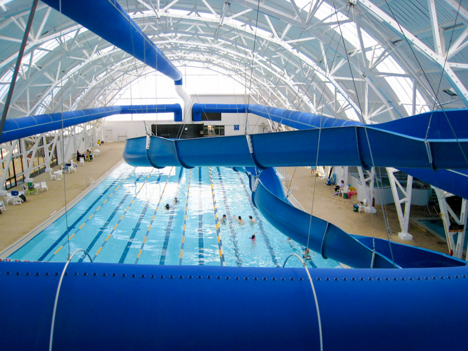 Blue air ducts installed in Elizabeth Aquadome swimming facility, Australia