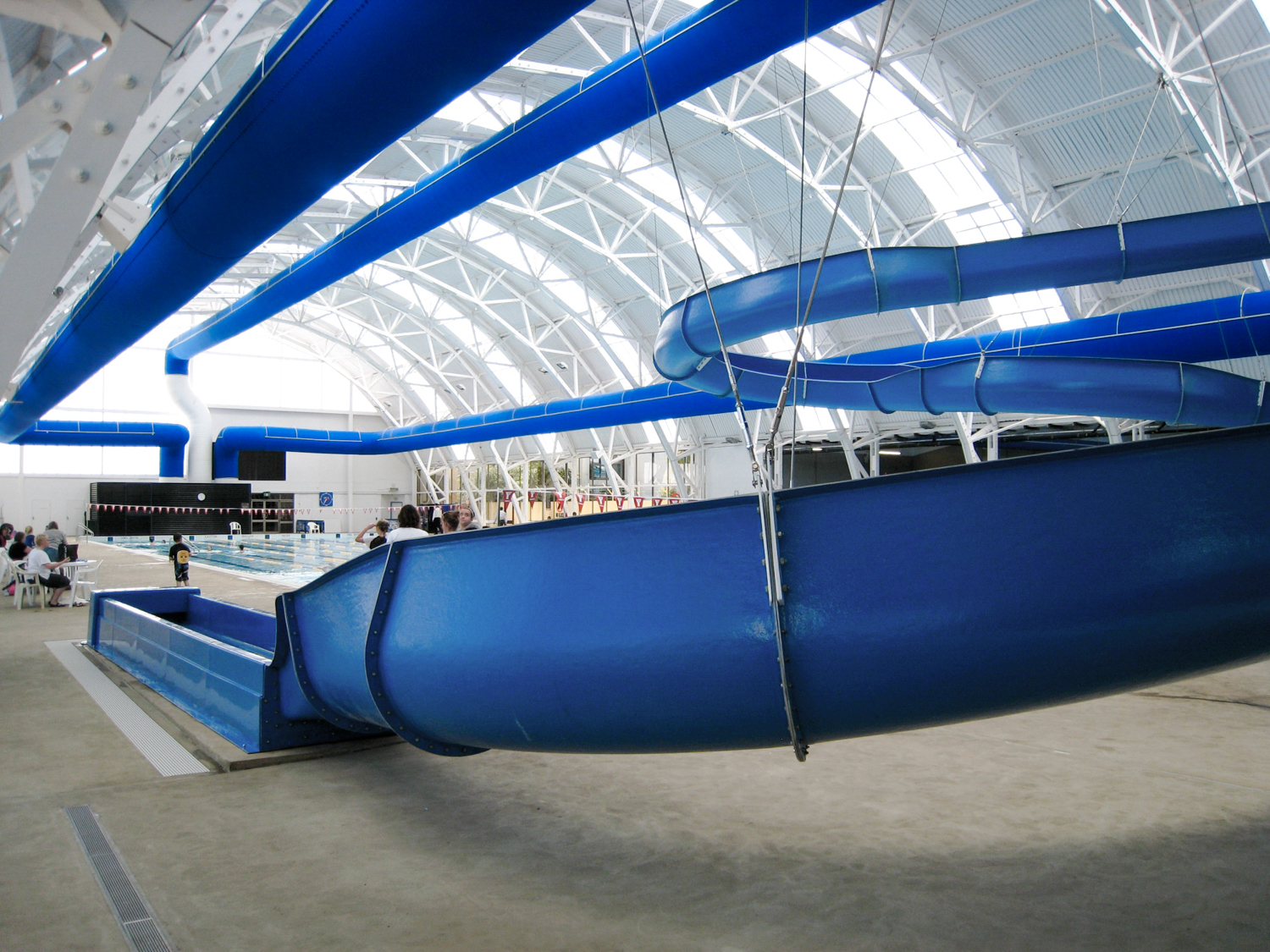 Blue ducts for air conditioning in Elizabeth Aquadome swimming pool facility, Australia