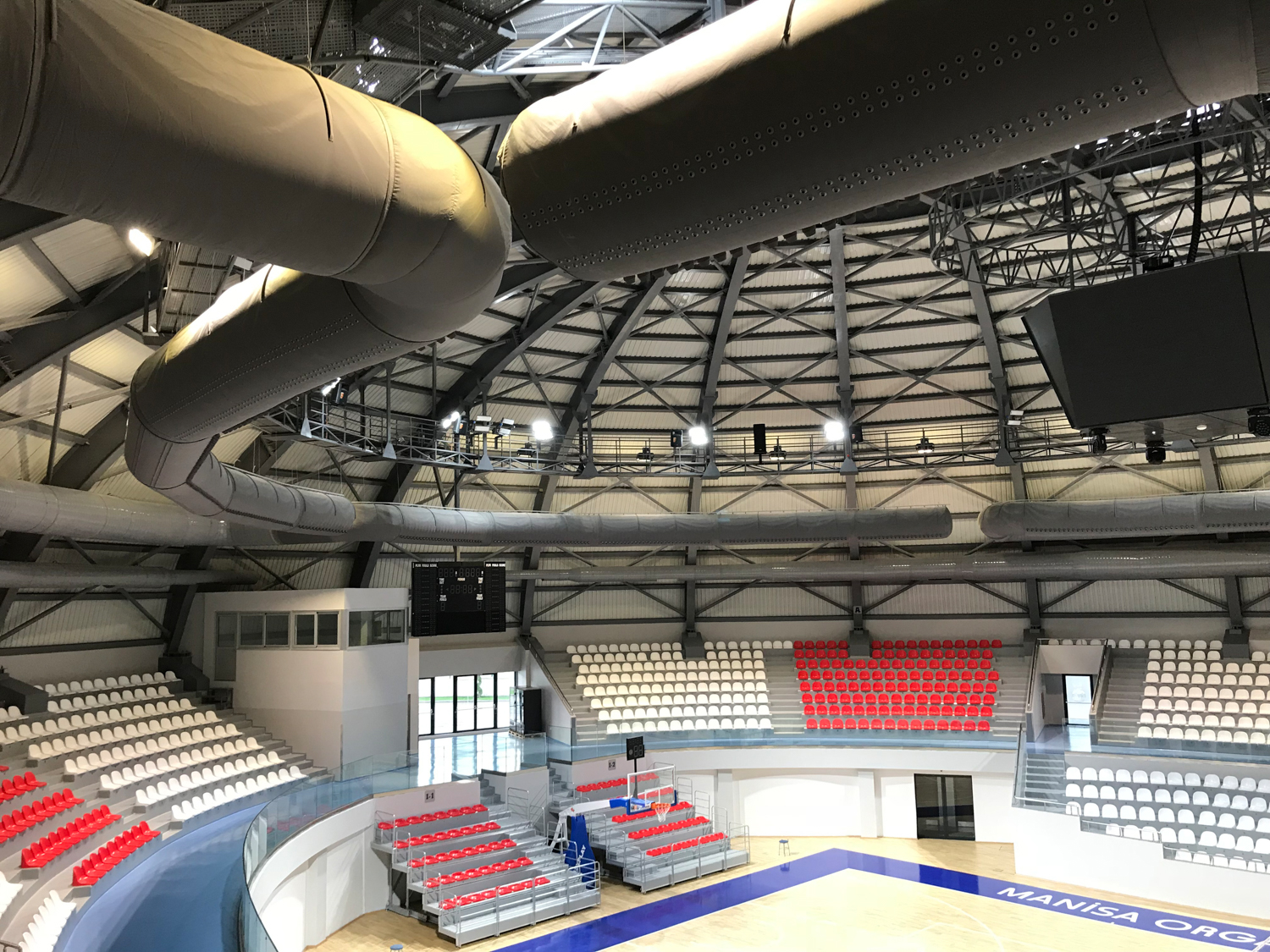 Black fabric duct installed in MOSB sports stadium, TR