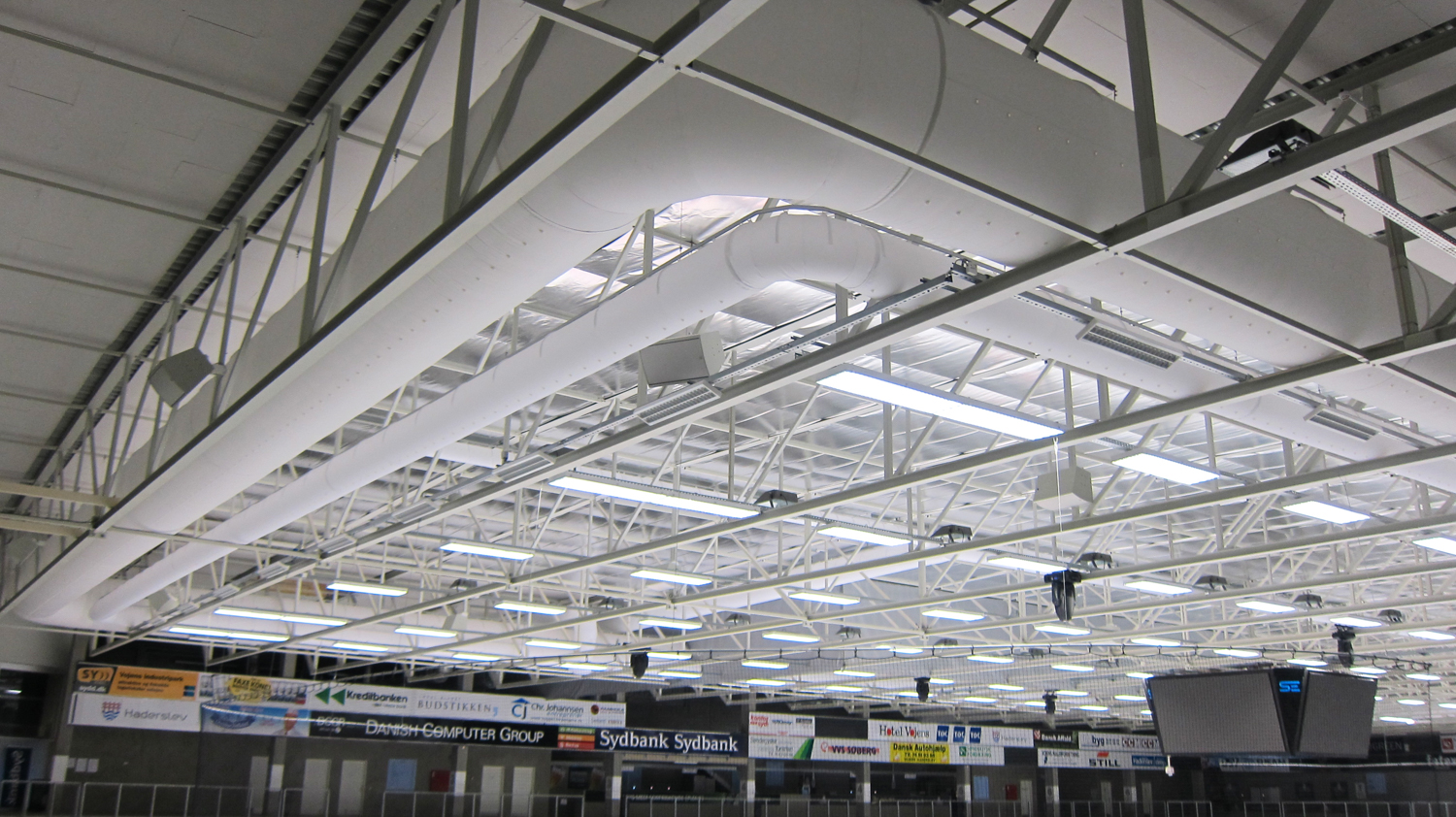 White oval ductwork installed in SE Arena, Denmark