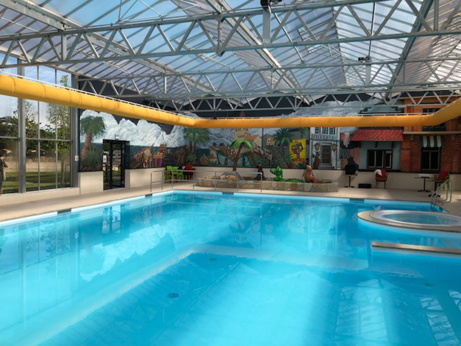 Orange duct systems inside an indoor swimming pool, CA