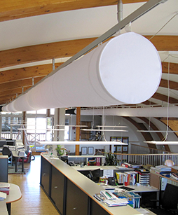 White oval ductwork inside an office, 2