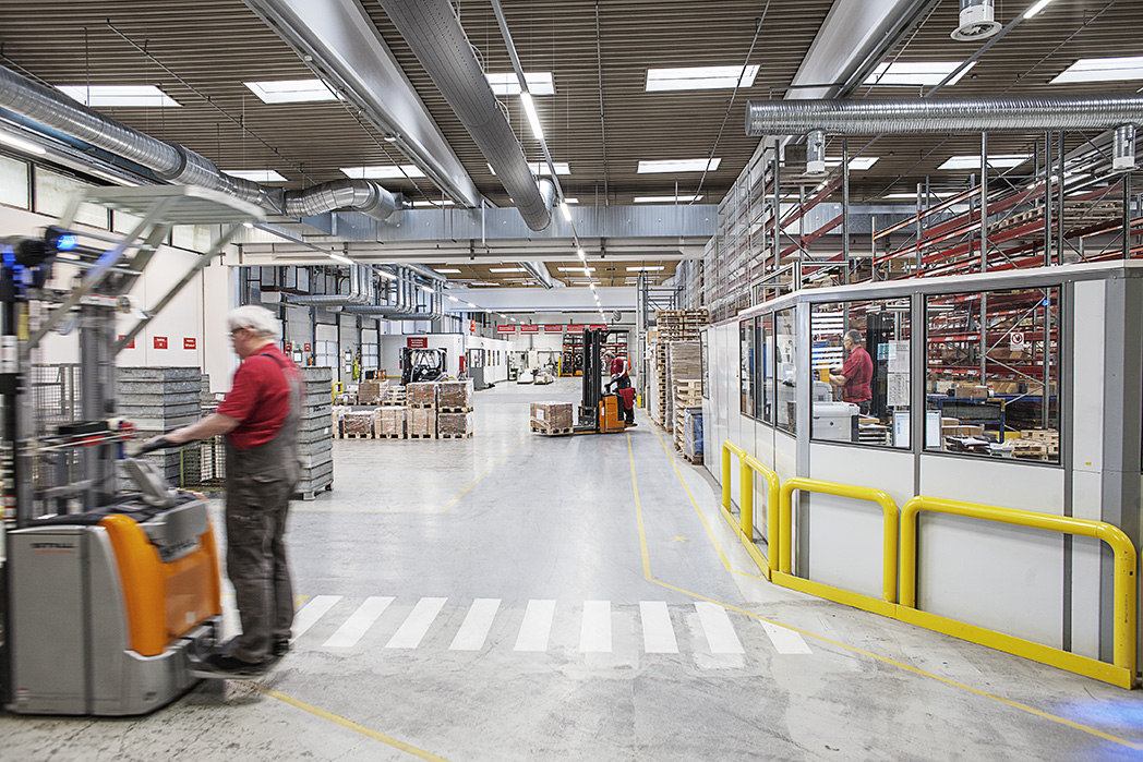 Danfoss factory interior with visible air ducts hangining from the ceiling, DK, 2