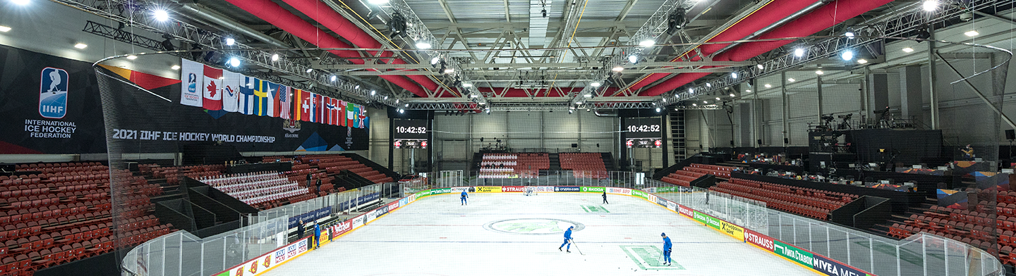 Red air ducts inside an indoor hockey arena, 2