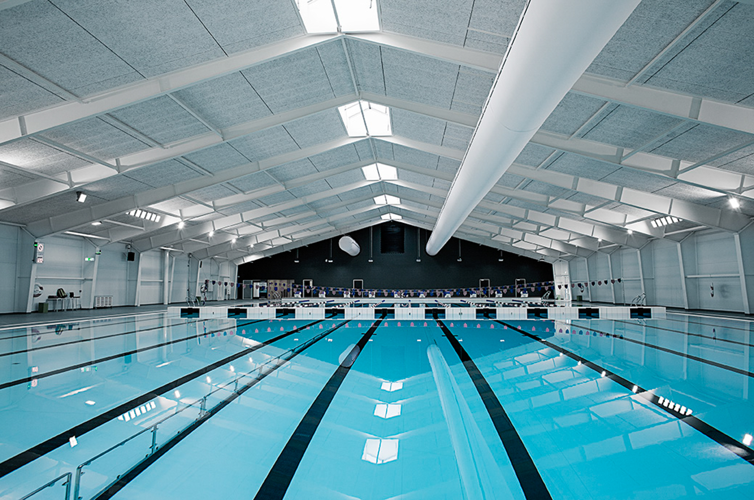 White swimming pool air distribution system in Taastrup Svømmehal, Denmark