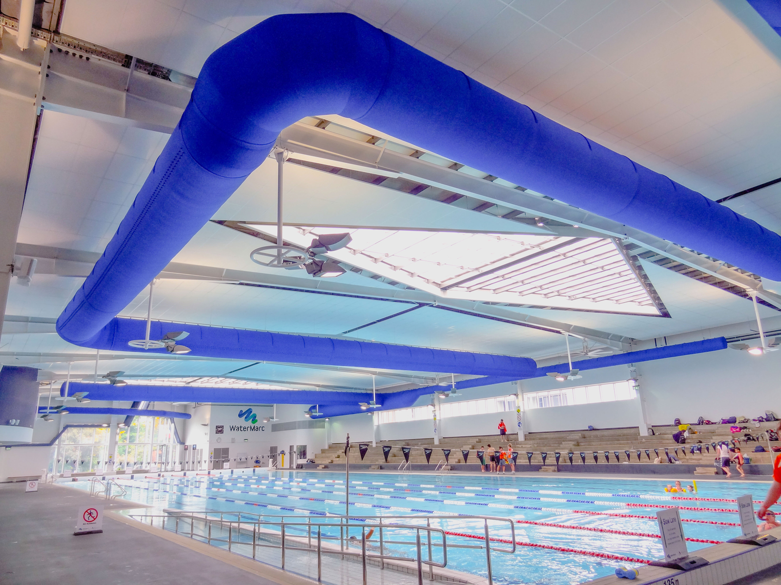 Blue duct systems inside Water Marc indoor swimming pool, AU, 2