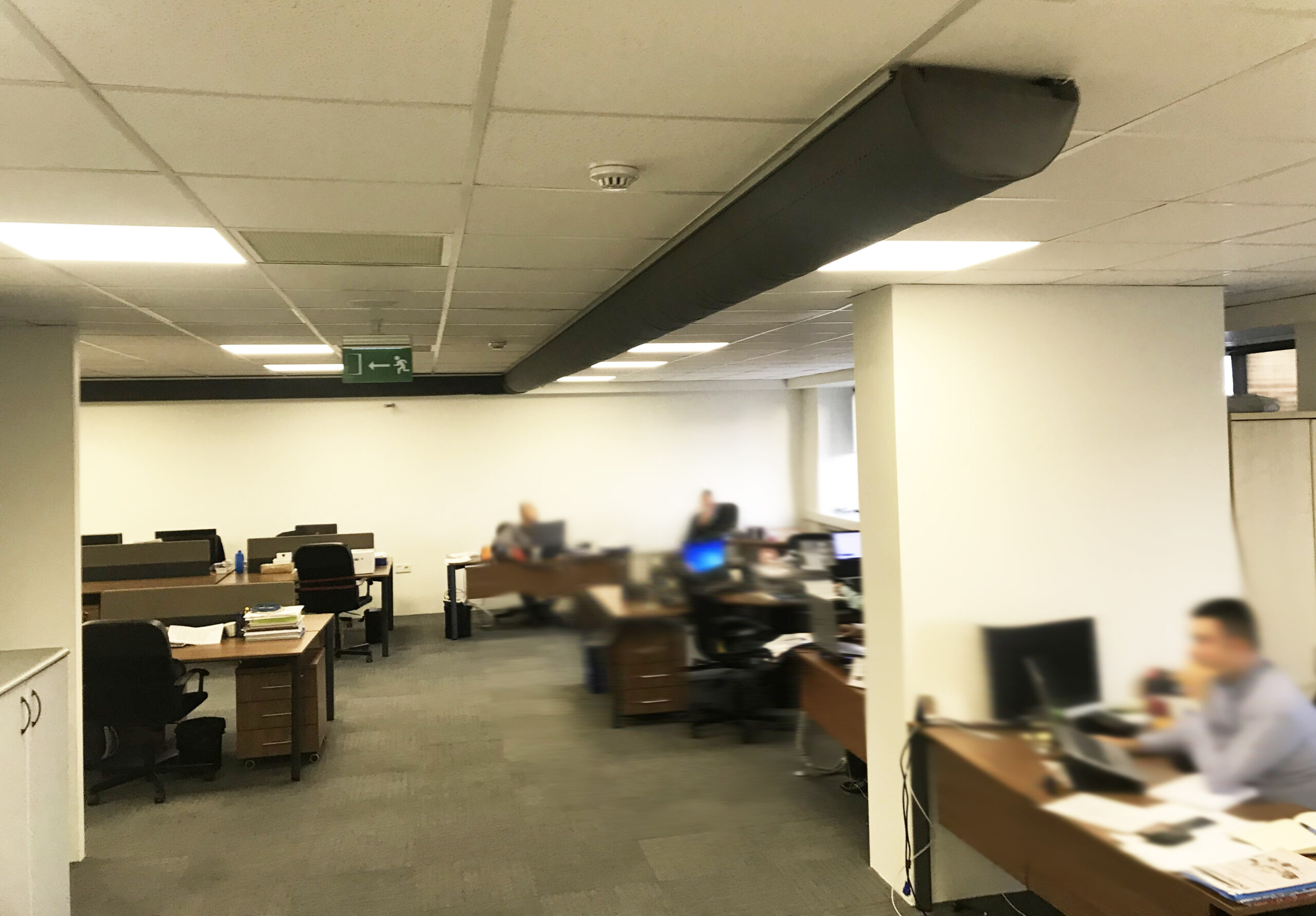 Black D-Shape air duct inside an office, 2
