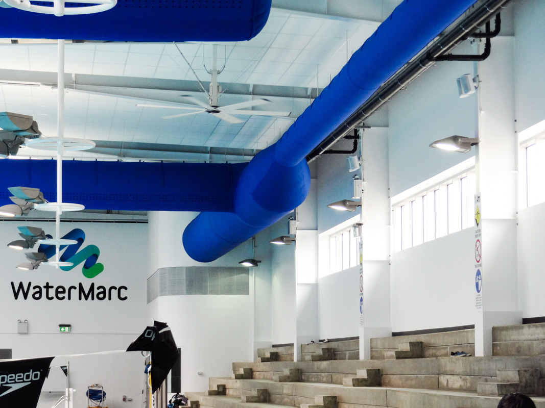 Blue HVAC fabric ducts inside WaterMarc indoor swimming pool facilities, Australia