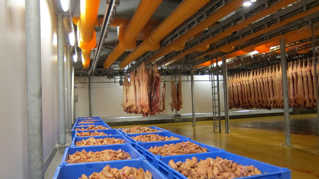 Orange air ducts inside a meat processing factory, 2
