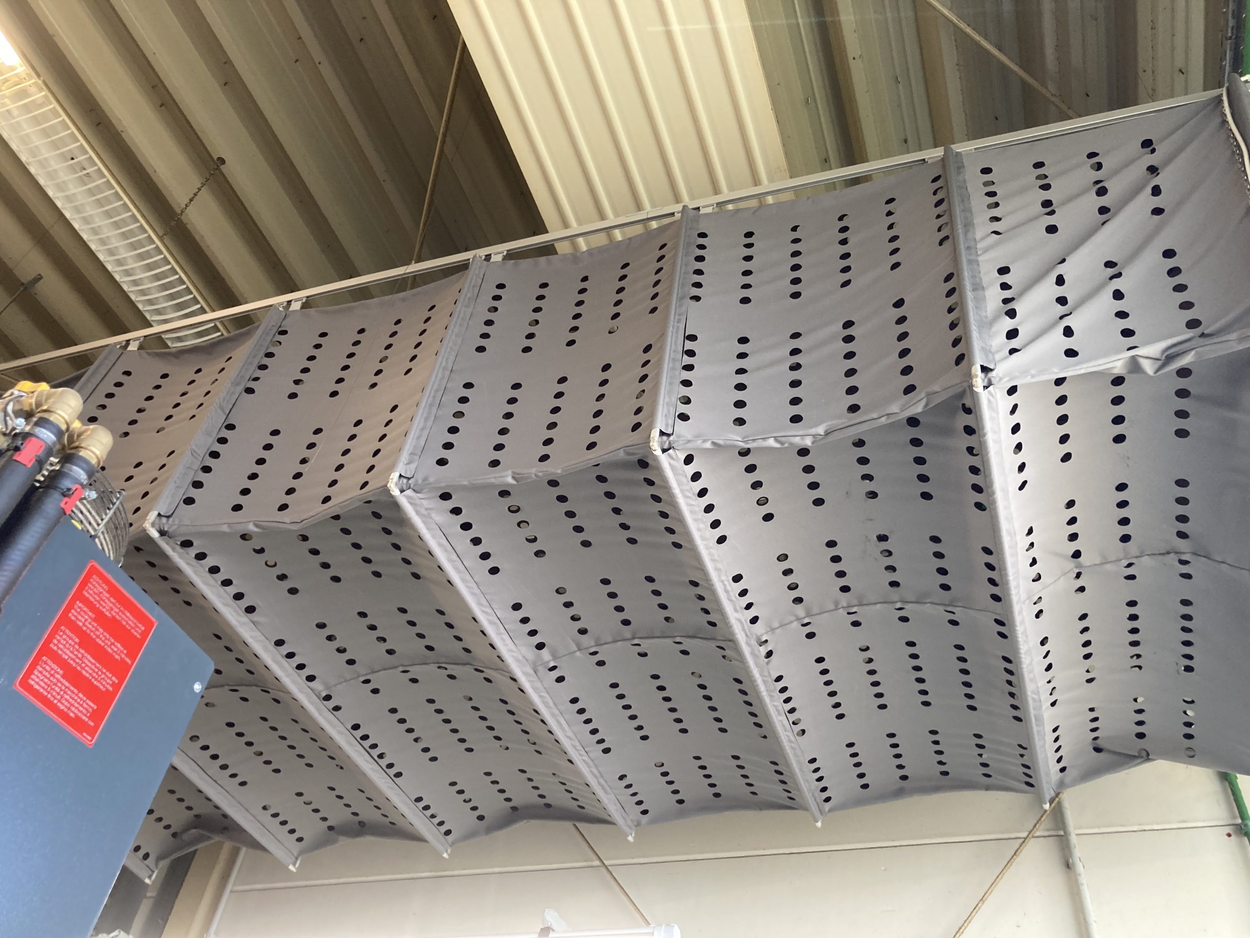 Industrial ducting system with perforations in Kirsch factory, Germany