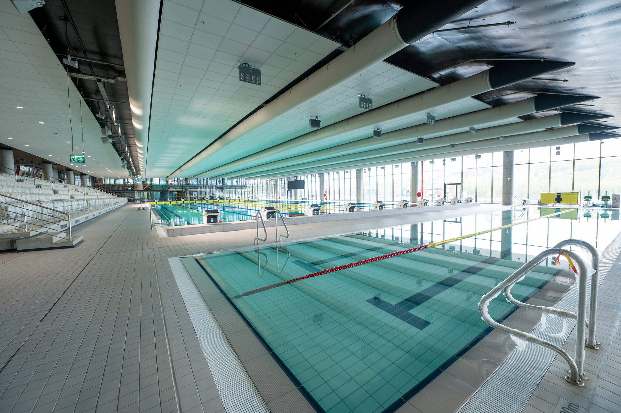 White air ducts installed inside Žalgiris Arena Water Sports Center, Lithuania