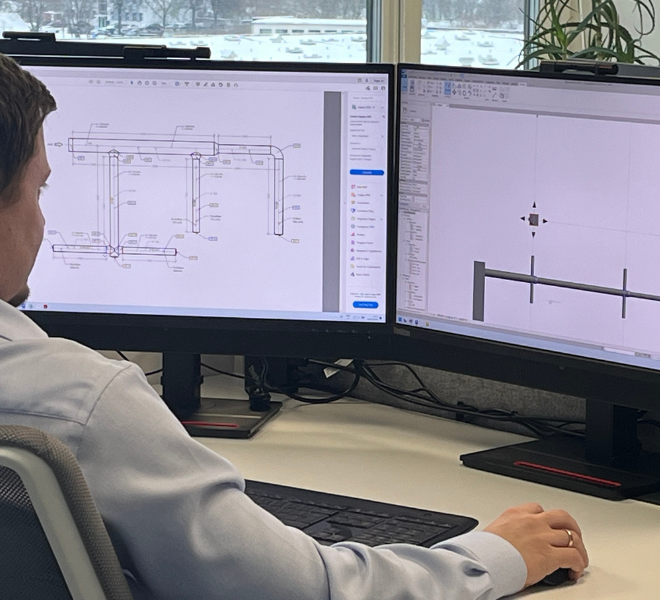 Engineer designing a product on a computer, 1