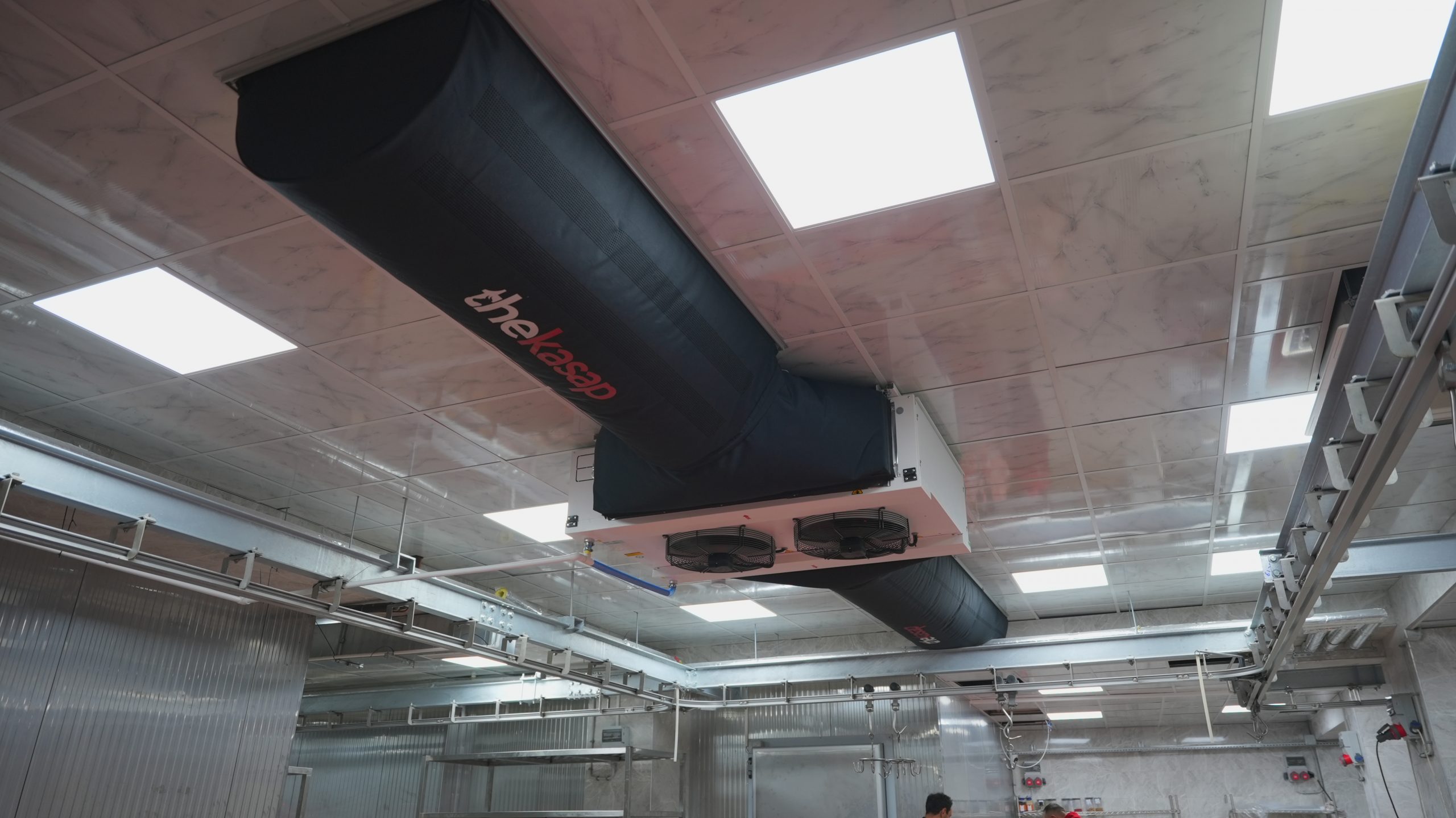 Black thekasap duct systems inside a factory