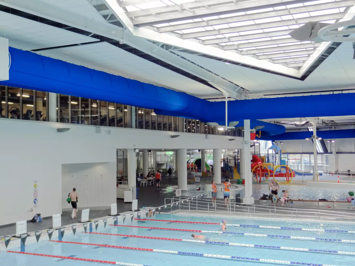 Blue air distribution system inside Greensborough swimming facility, Australia