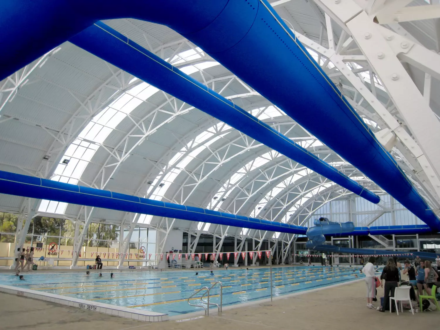 Blue air ducts in Elizabeth Aquadome indoor swimming pool, Australia