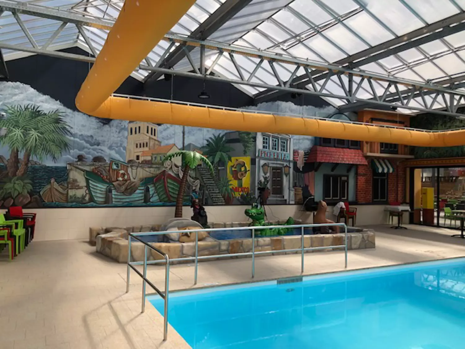 Orange oval ductwork in an indoor swimming facility, CA