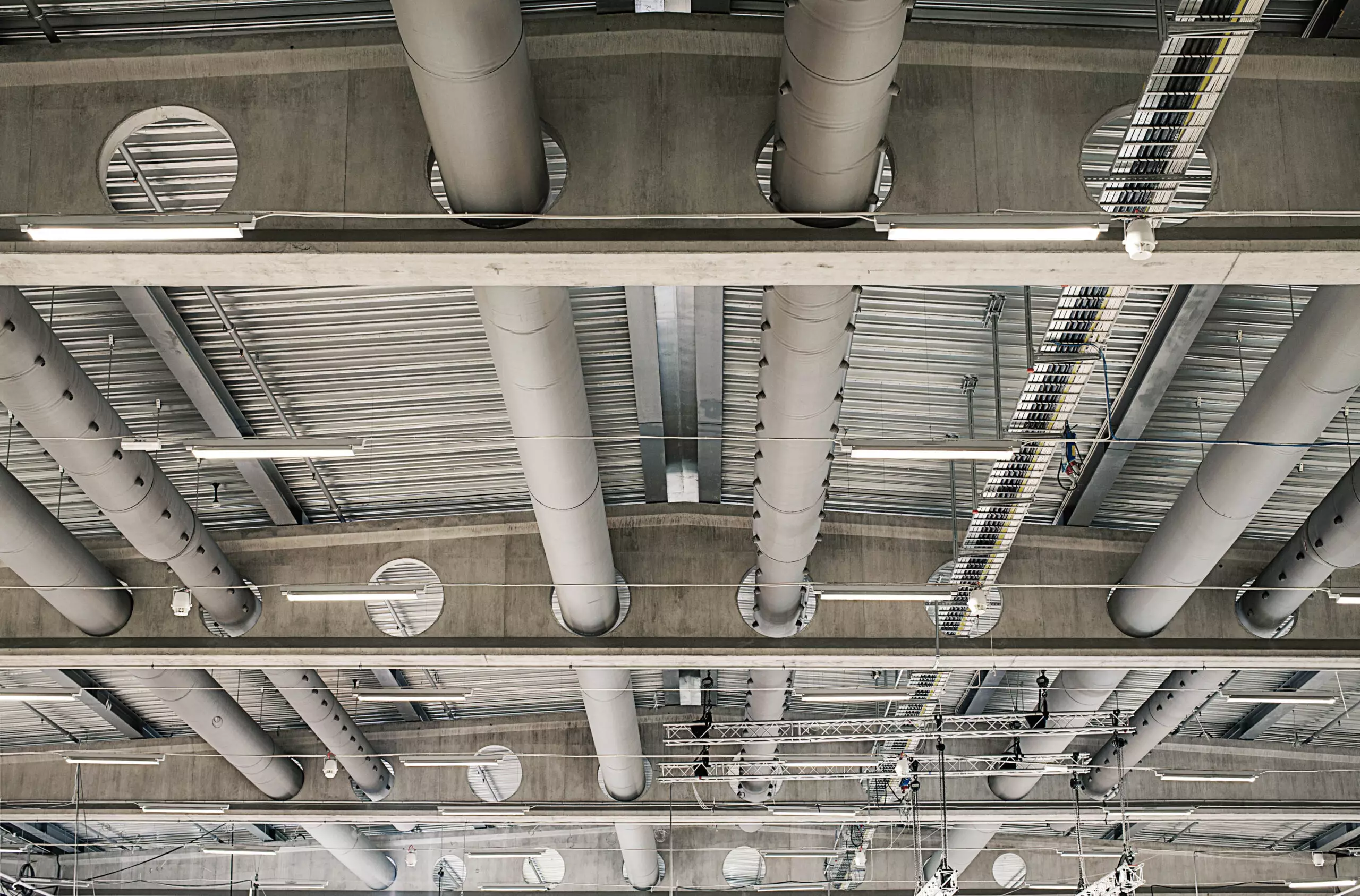 Grey commercial duct systems inside Malmø Messan Exhibition hall, SE, 2