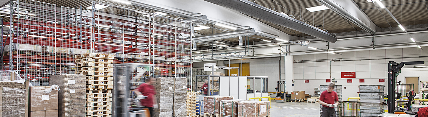 White fabric duct installed inside Danfoss warehouse, Denmark