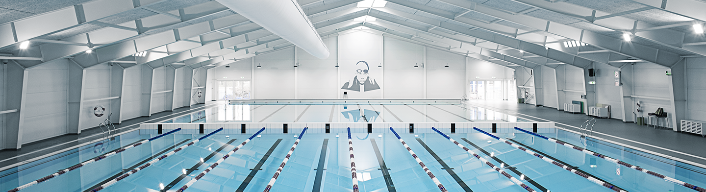 White fabric duct installed inside a swimming pool facility, IN