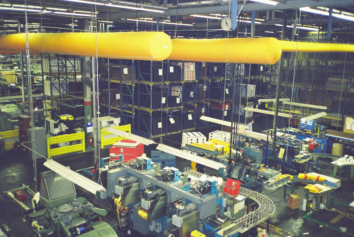 Yellow fabric duct installed inside Danfoss factory, Denmark