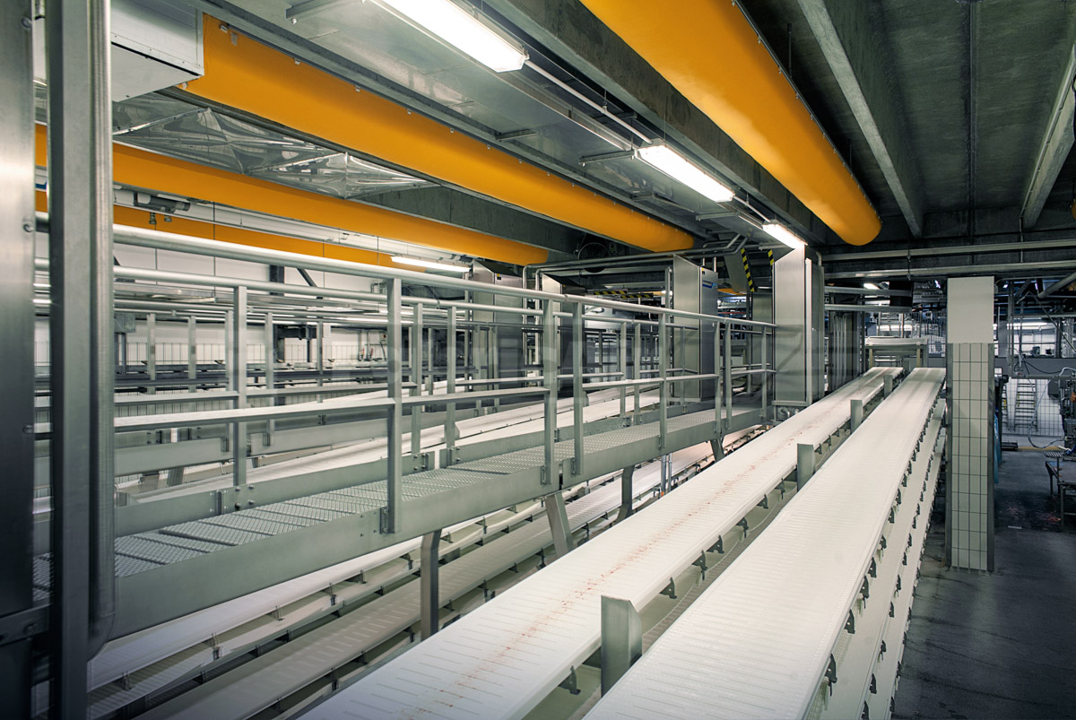 Orange industrial air ducts in Danish Crown meat processing factory, Denmark