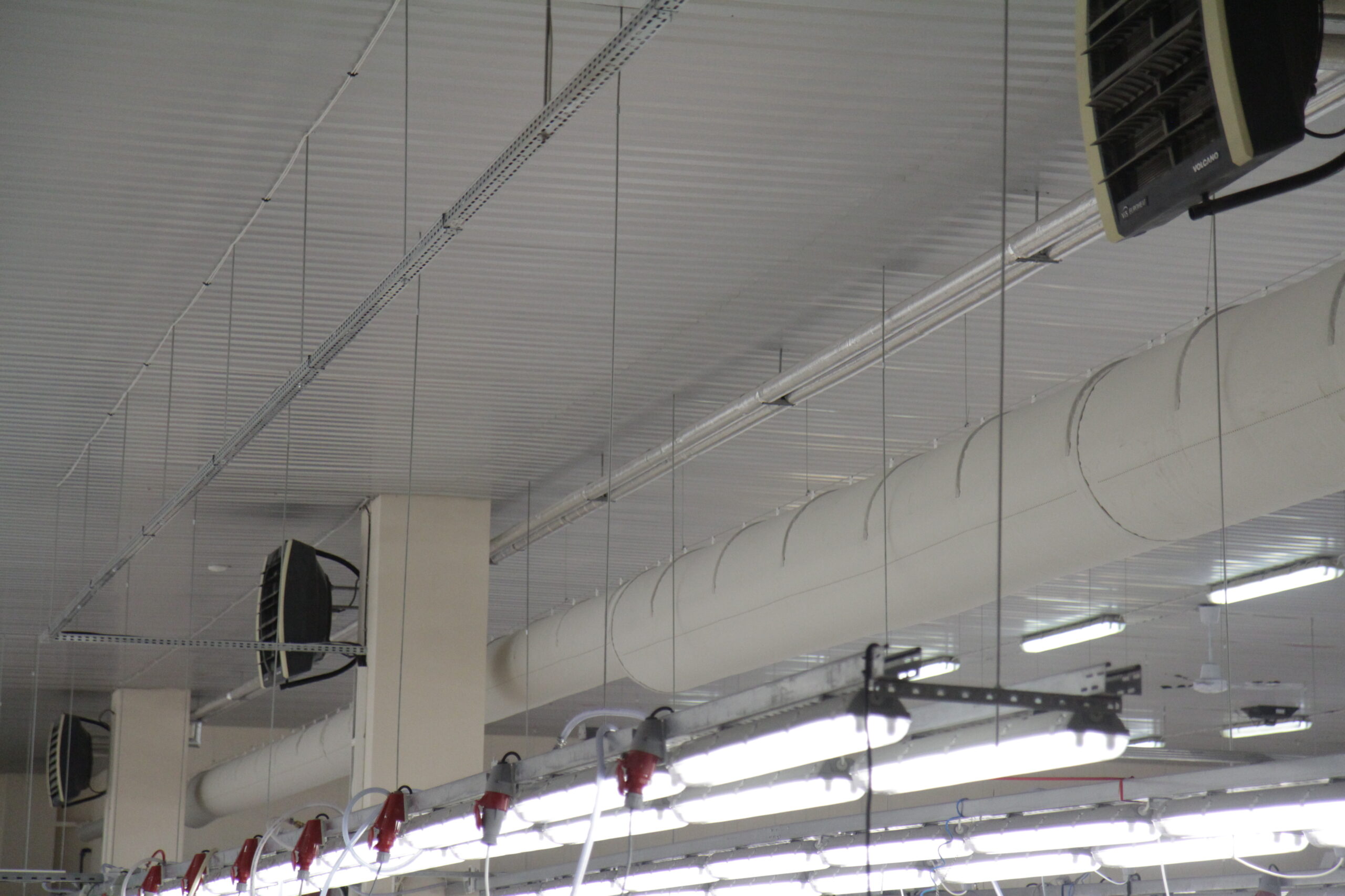 White fabric duct installed in Haltex sport apparel store, Lithuania