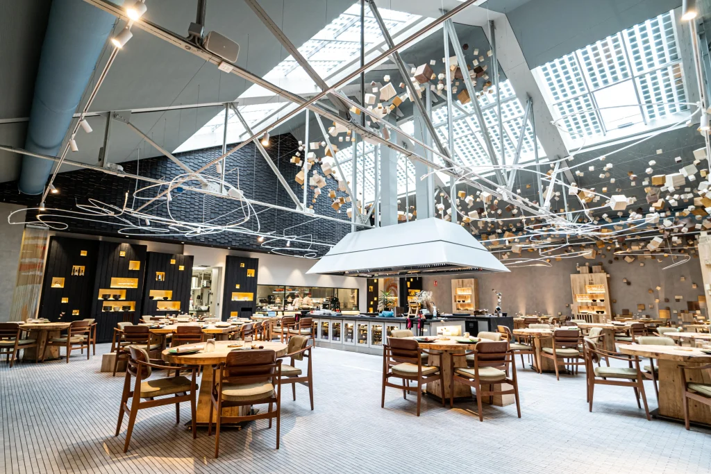 Gray fabric ducts installed in the dining room of Omeraki, a Michelin starred restaurant in Madrid.