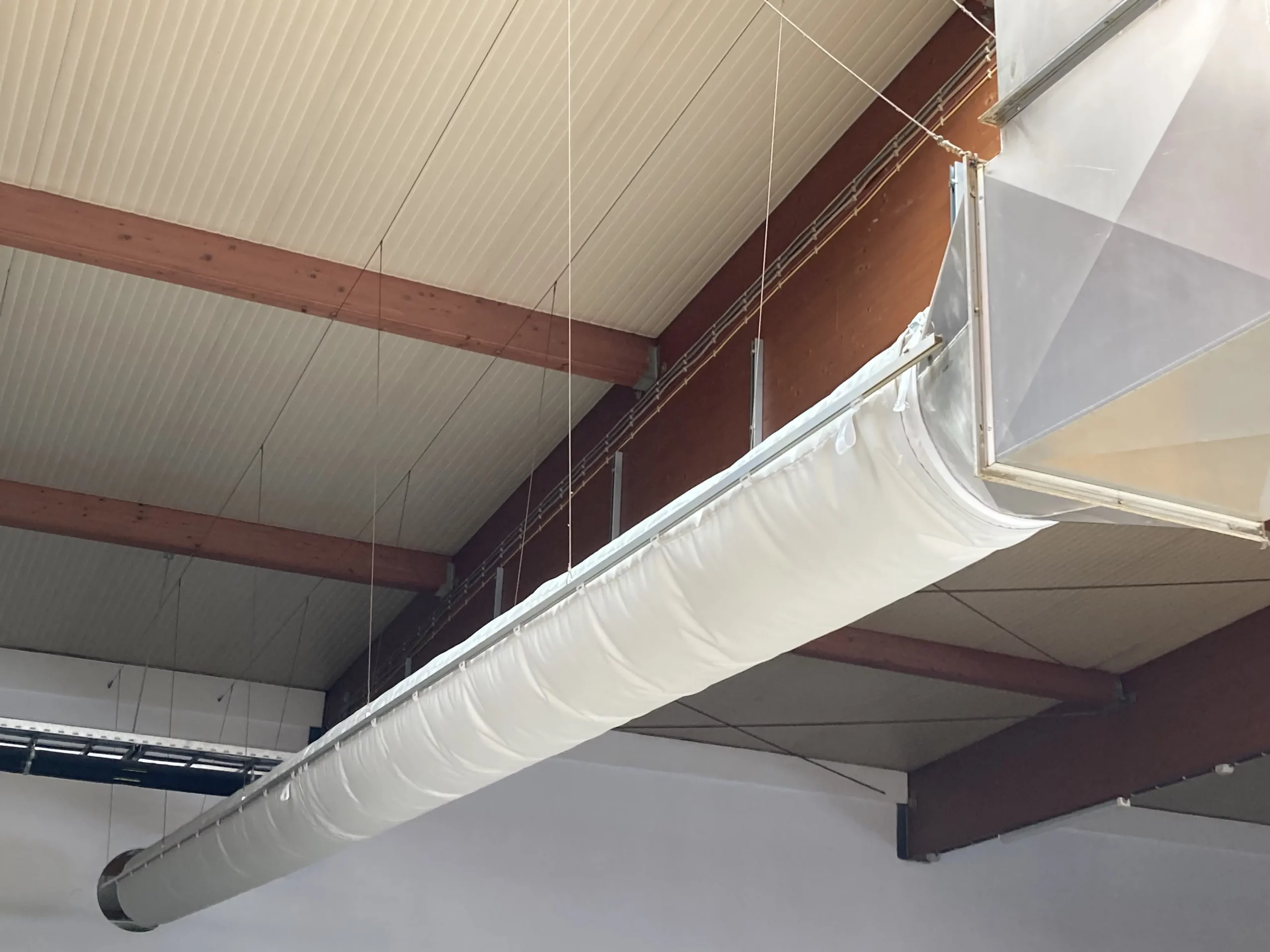 FabricAir fabric duct installed in a German bakery that improves indoor air quality and saves up to 80% on energy costs