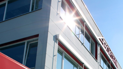 Gray FabricAir ducts are installed at the Agoform manufacturing facility in Germany. The All-in-One shape retention system ensures that the duct remains open for a full look even when the system is turned off.