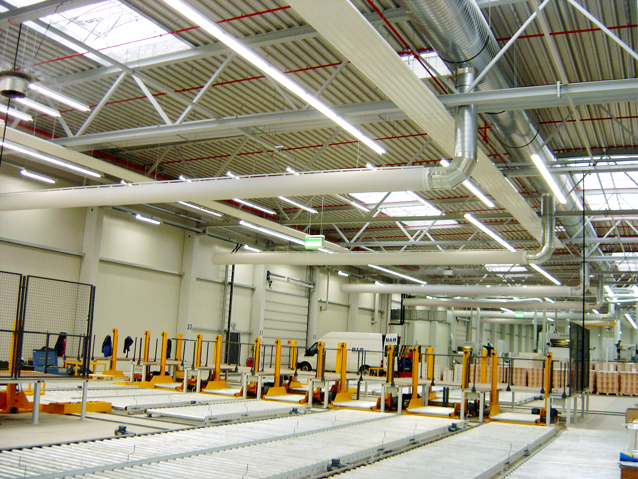 Industrial air duct systems with white air duct design inside a logistics center, UK, 2
