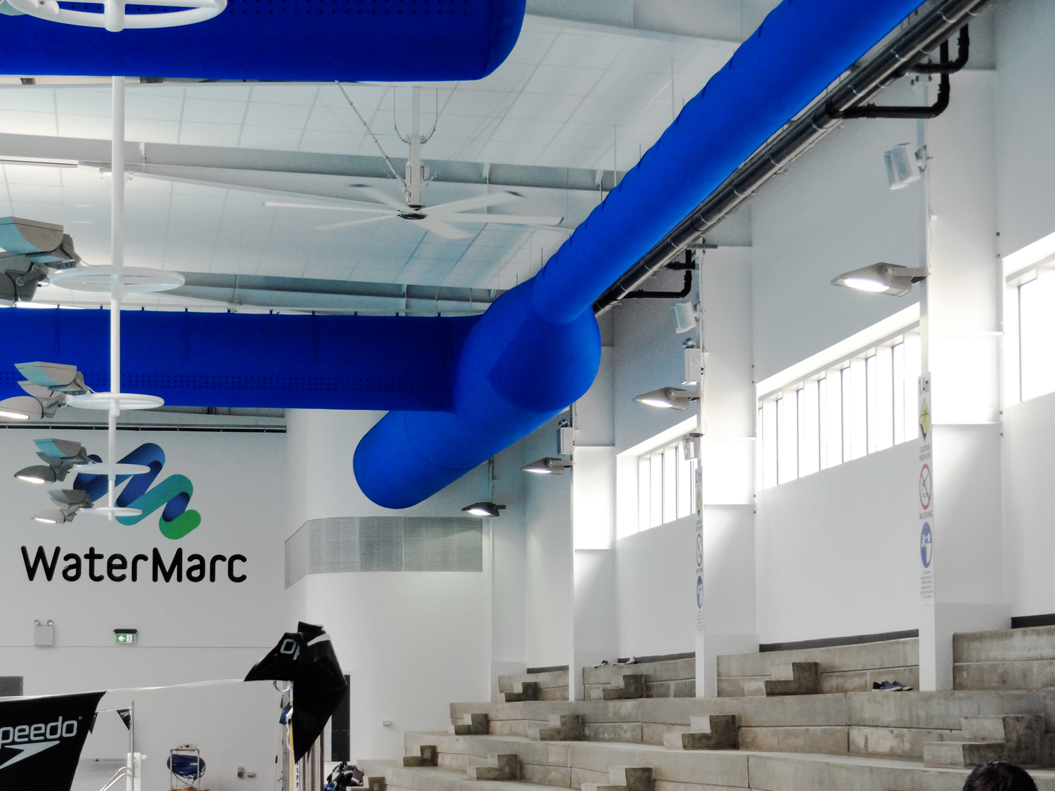 Blue ventilation ducts installed inside WaterMark swimming pool facility in Greensborough, Australia, 2