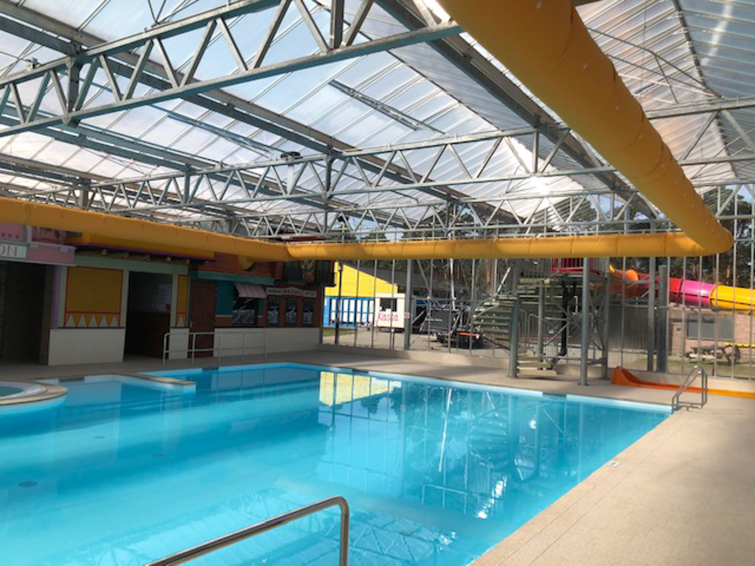 Orange air duct systems with fabric ducts iniside a holiday park Blauwe Meer, Lommel, Belgium, 2