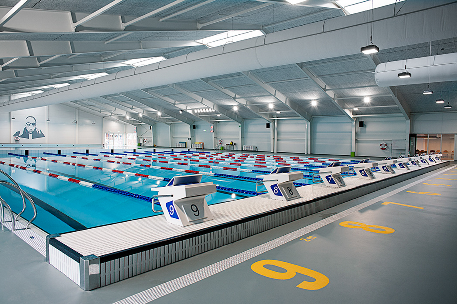 White air duct systems with ventilation ducts installed in Taastrup Svømmehal swimming pool facility, Denmark, 2