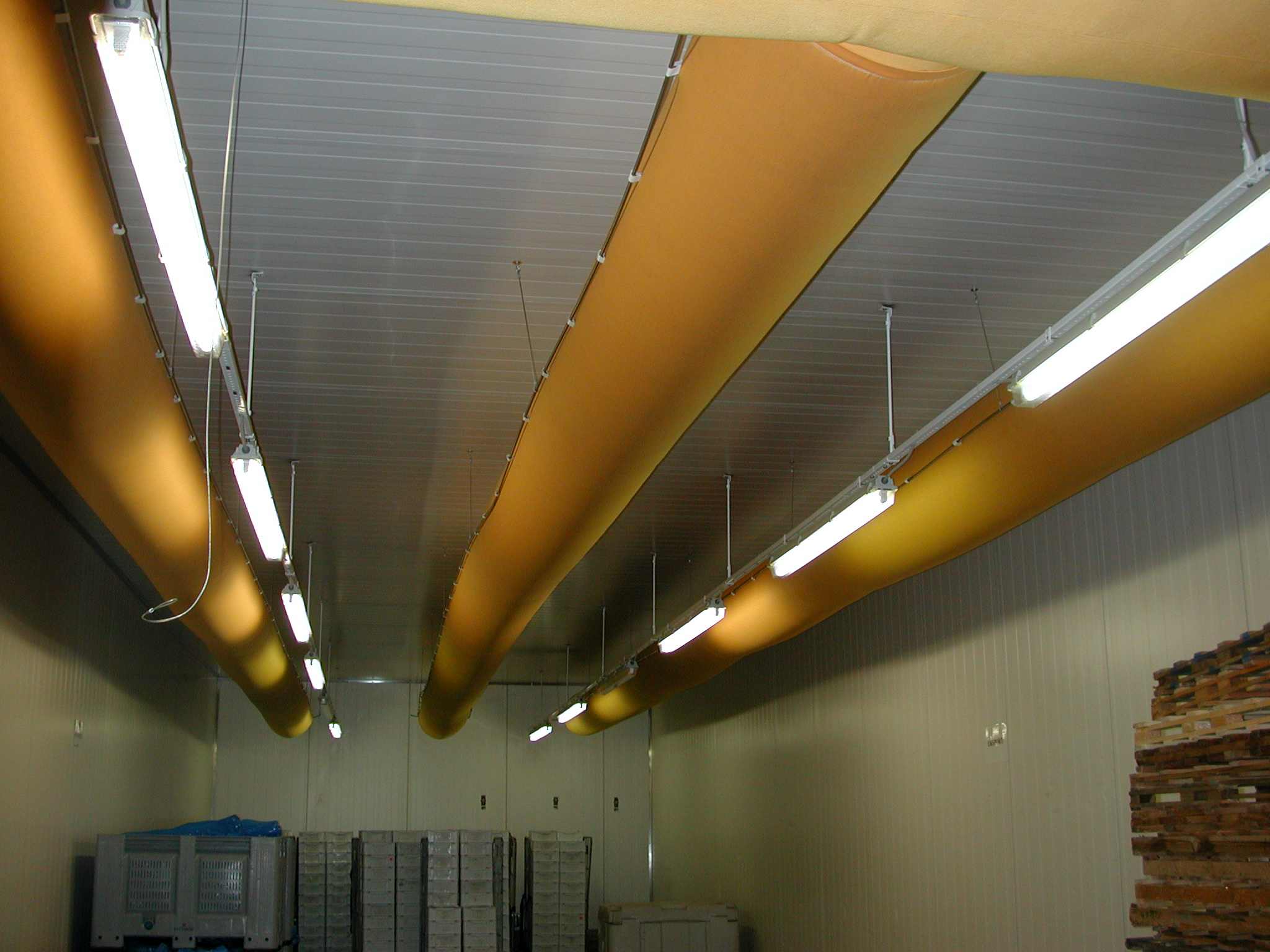 Orange air duct systems with ventilation ducts inside a factory, Denmark, 2