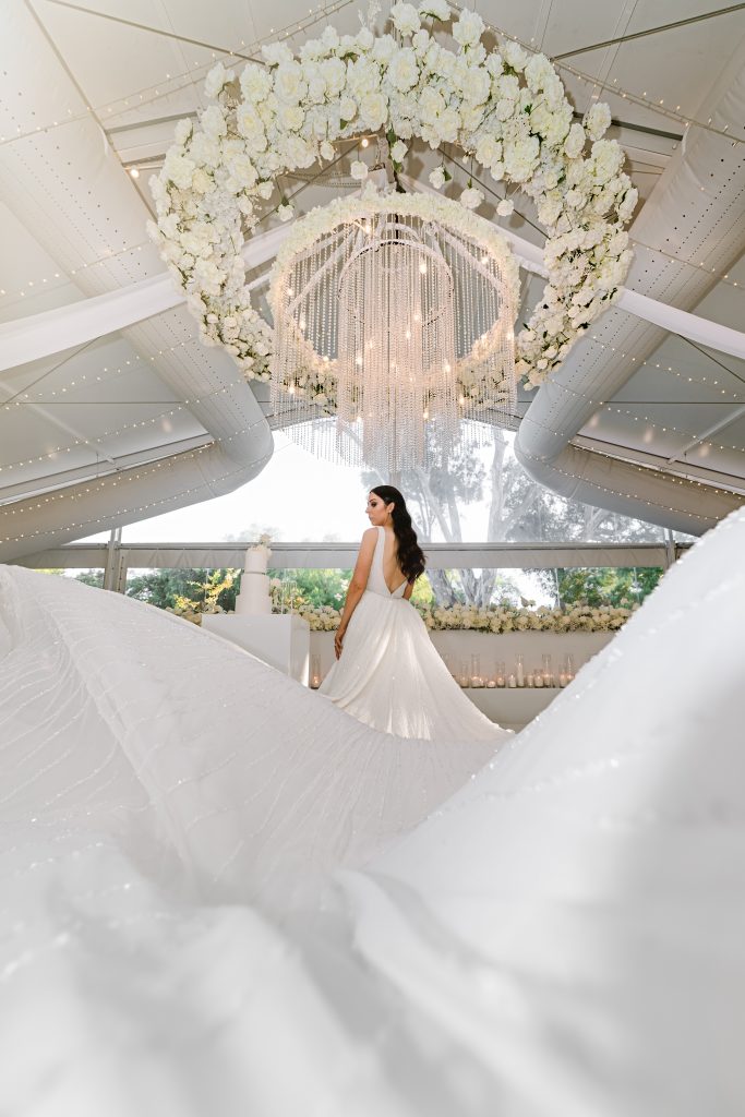 A wedding bride standing underneath white air duct systems installed in Sunnybrae Estate event room, South Australia, 2