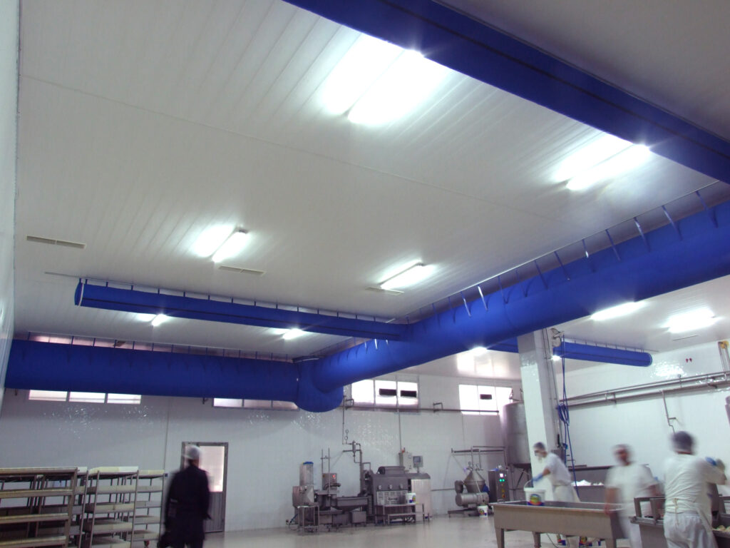 Factory air duct systems with blue fabric ducts installed in İnan Süt, Turkey, 2