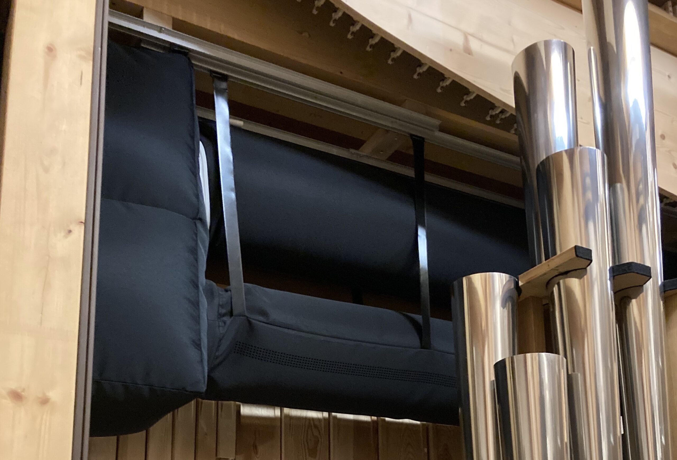Fabric duct system with black ventilation ducts installed in Leipzig University church, Germany, 2