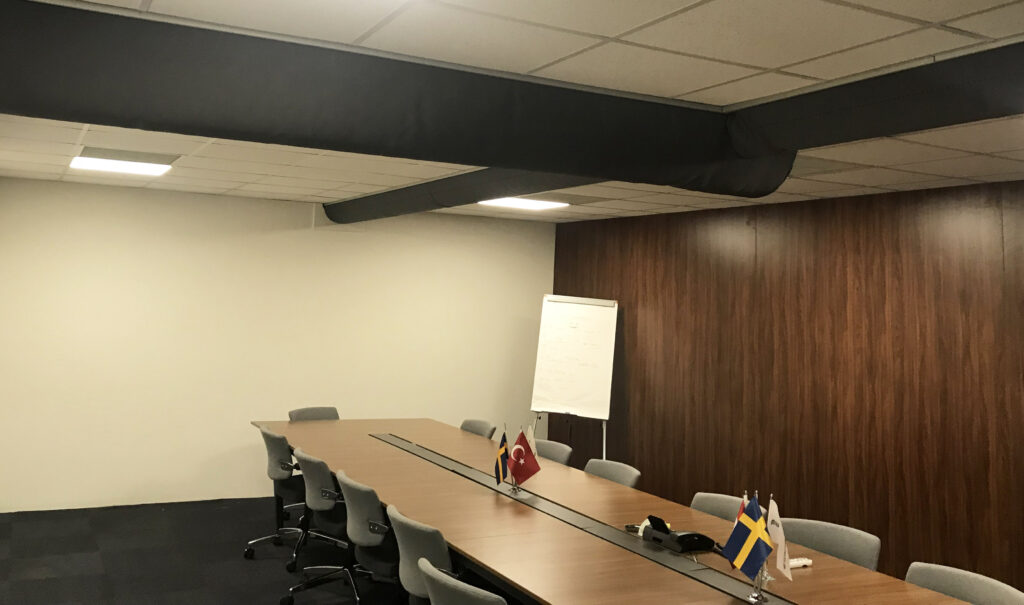 Air duct system with black ventilation ducts created by FabricAir, inside Systemair HSK office, Turkey, 2