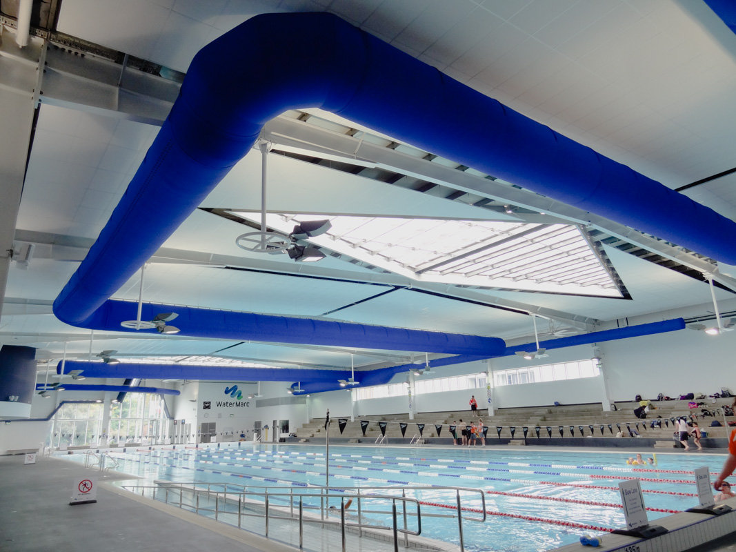 Air duct system with blue design in a swimming pool facility Watermarc, Greensborough, Australia, 2