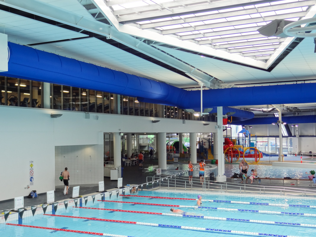 Blue ventilation ducts installed in a swimming pool facility Watermarc, Greensborough, Australia, 2