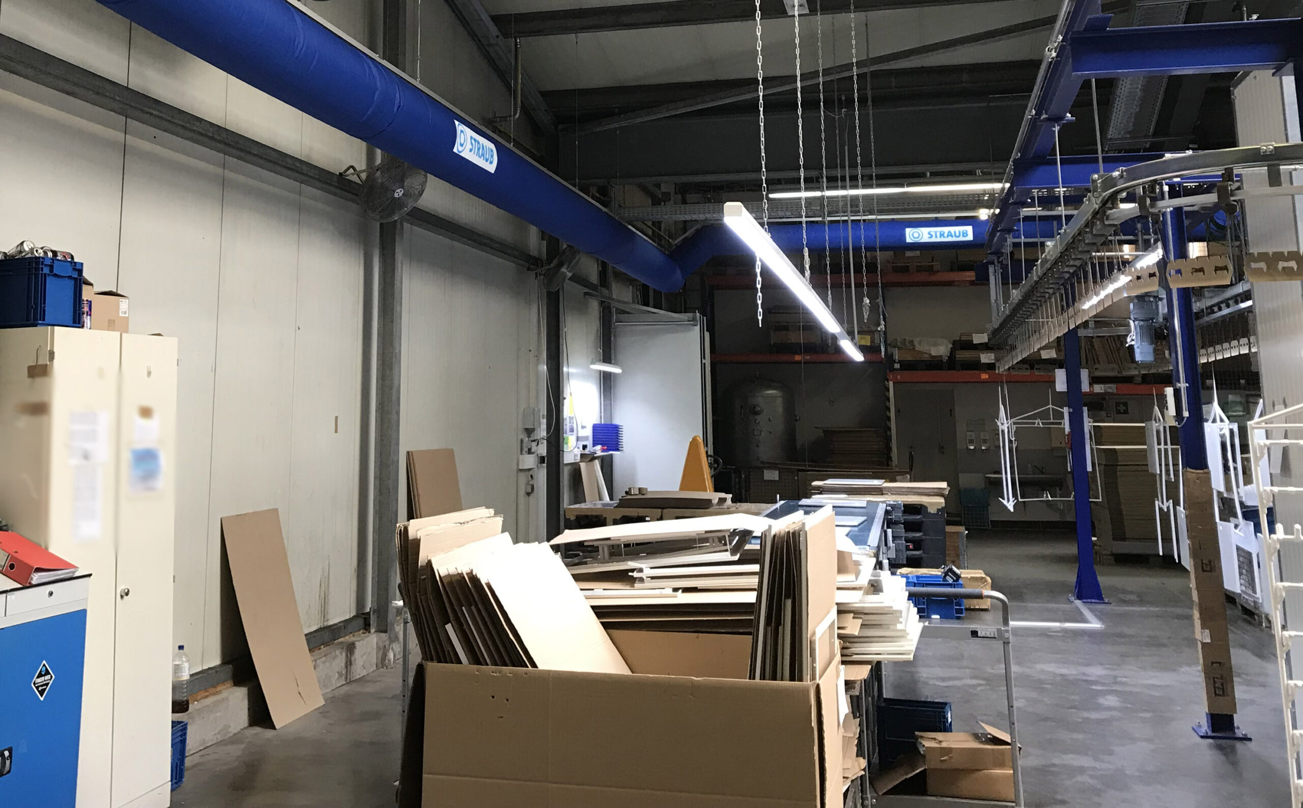 Industrial air duct system with blue air duct design inside a factory, STRAUB KG, Germany, 2