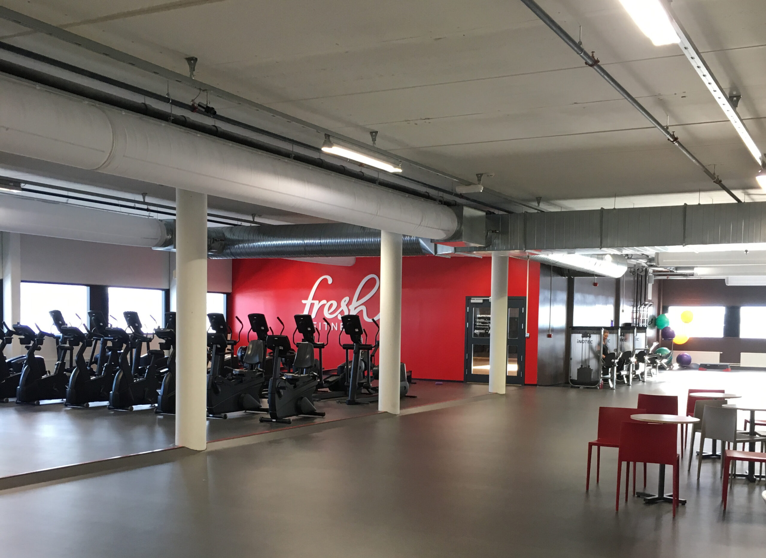 White fabric duct system with ventilation ducts in Fresh Fitness gym, Trondheim, Norway, 2
