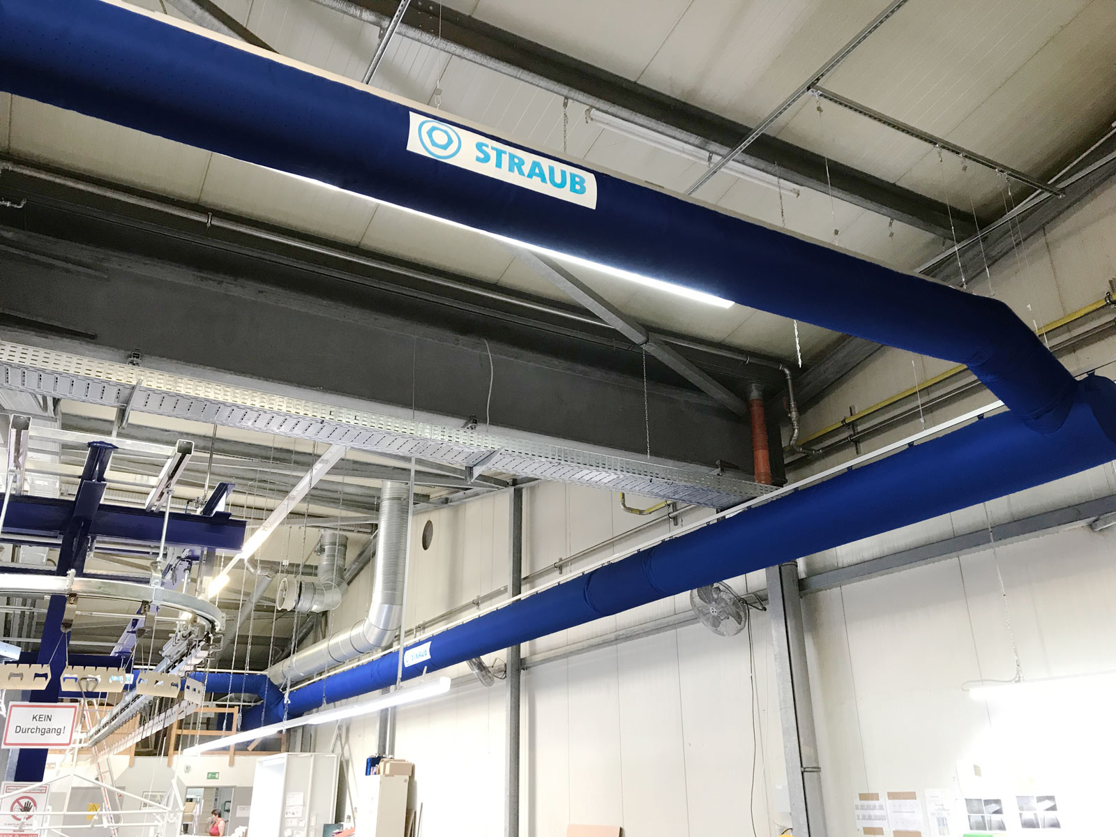 Industrial air duct system with blue fabric duct design inside a factory, STRAUB KG, Germany, 2