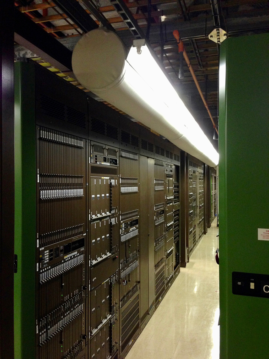 White ductwork system with ventilation ducts installed inside a telecom Facility, Pacific Northwest, Canada, 2