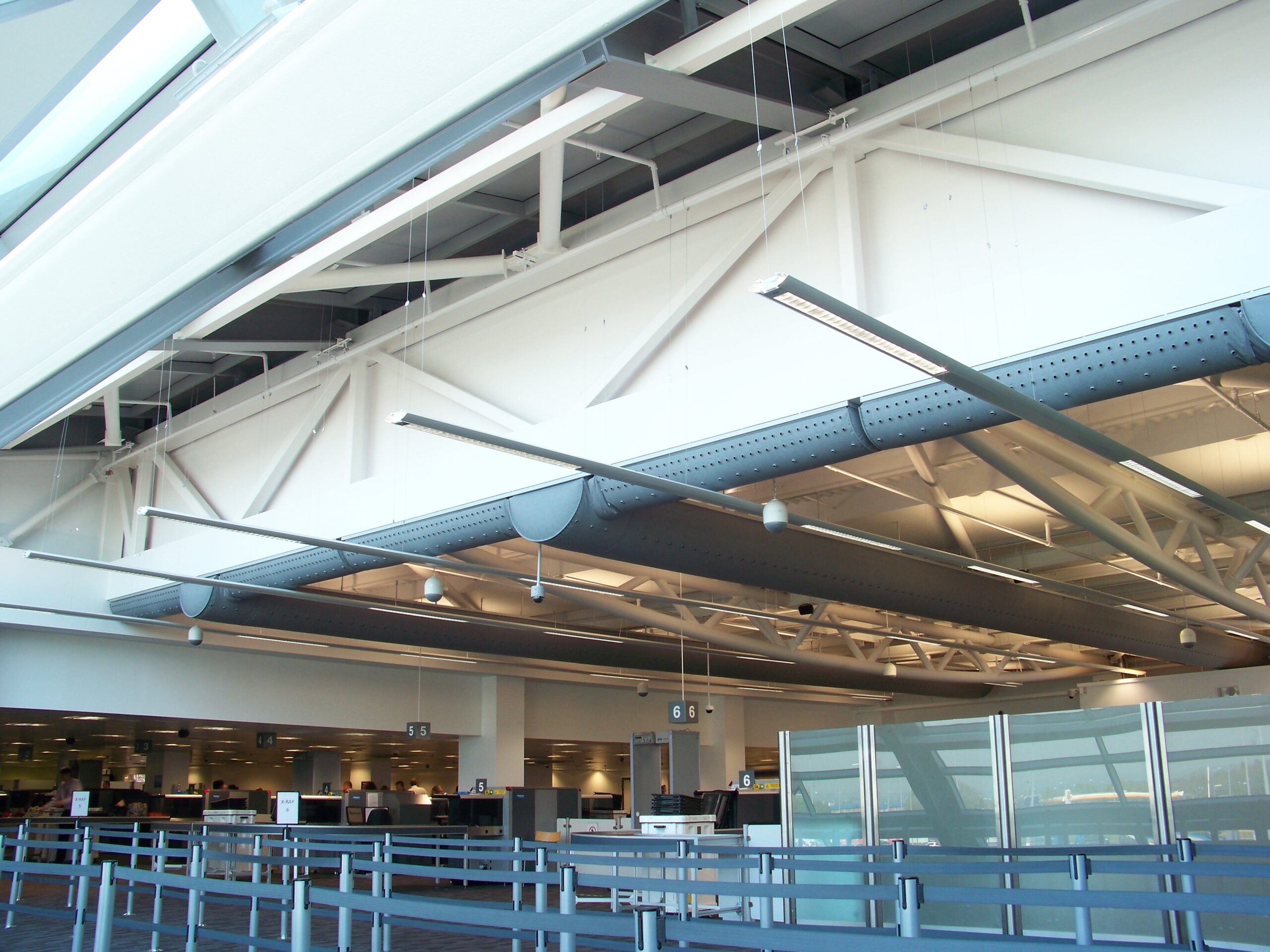 Grey air duct system, also called a ductwork system, inside Newcastle Airport, UK, 2