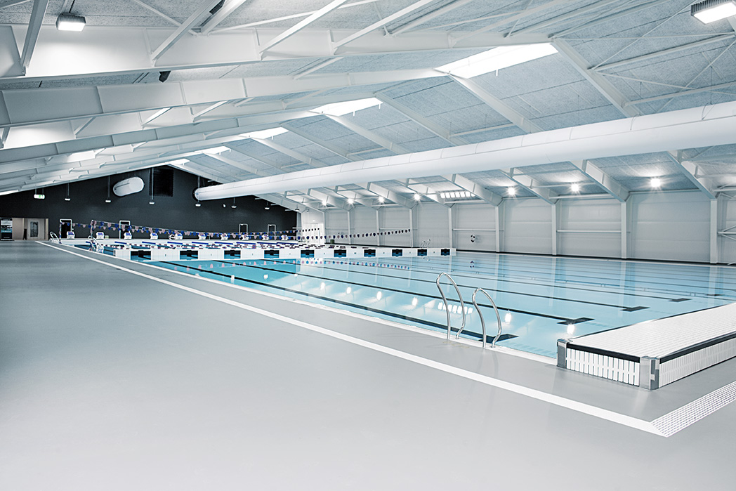 Swimming pool ductwork system with white air duct design inside Taastrup Natatorium, Denmark, 2